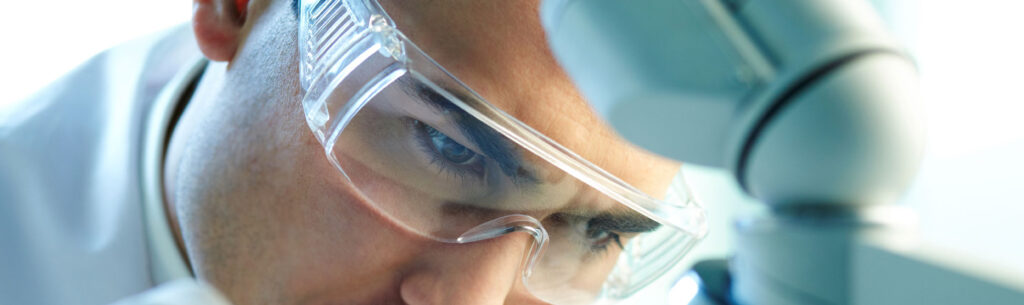 Researcher with safety glasses working